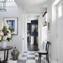 Bedfordshire Countryside Family Home | Entrance Hall with a statement checkerboard marble floor | Interior Designers